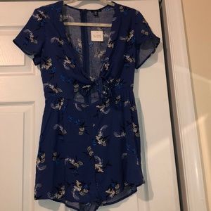 Blue floral romper never worn new with tags